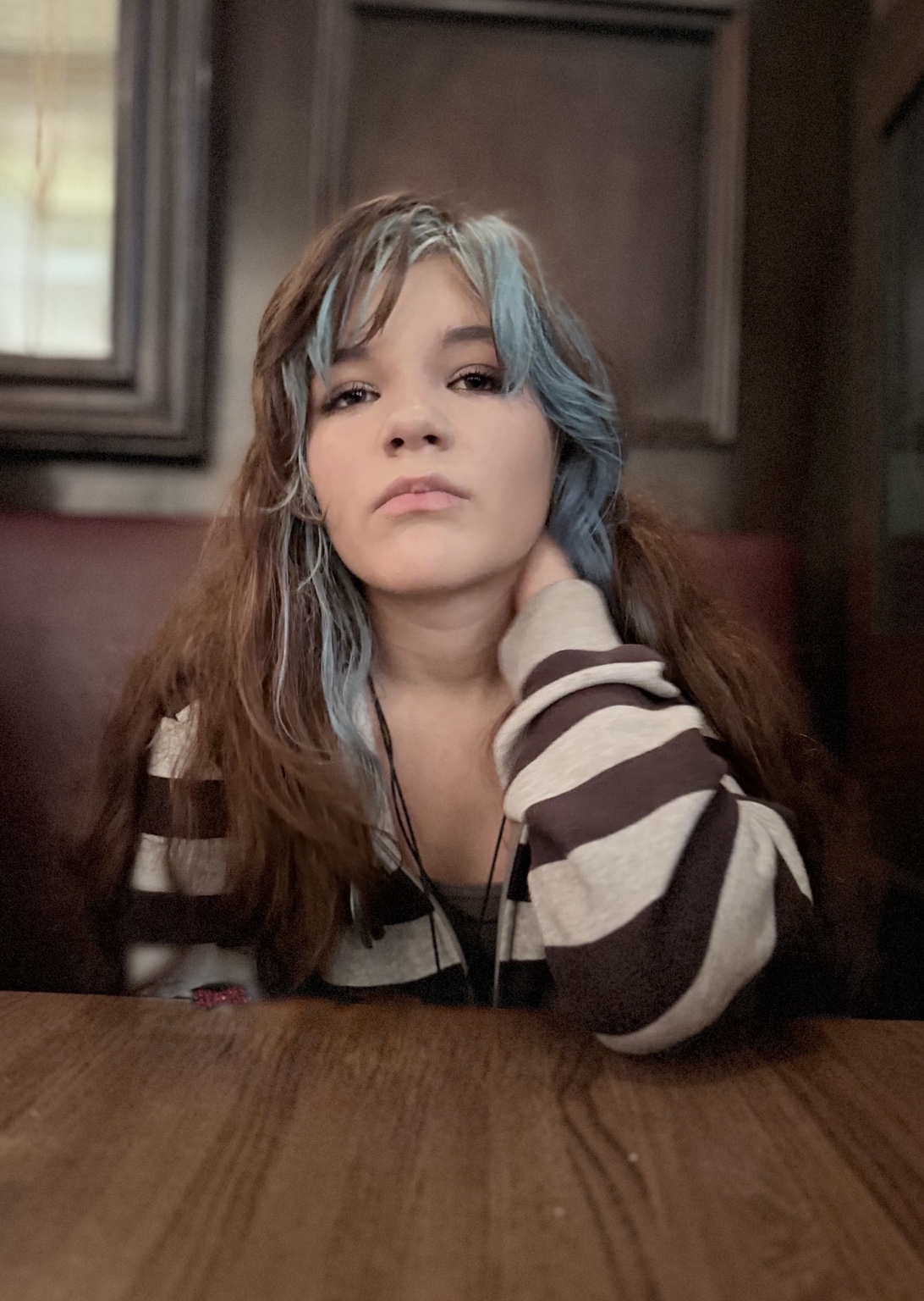 Portrait of Eden seated at a table